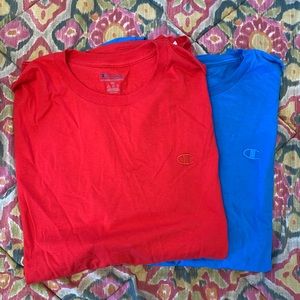 2 brand new Champion Tee Shirts. One red and one blue
